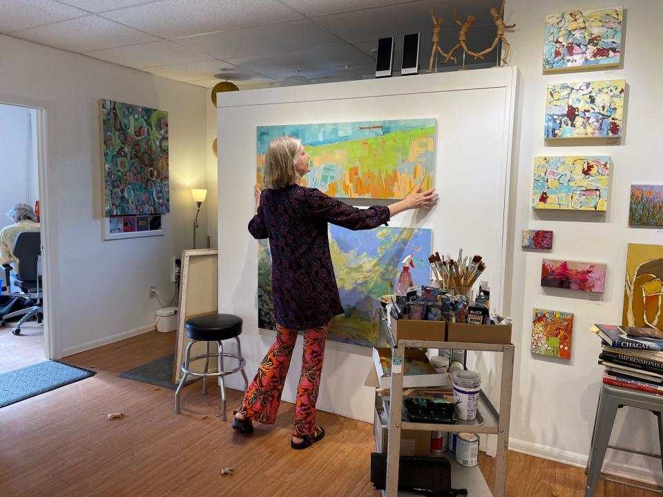 Art Up Front Street owner Rose Bryant showcases her current work in her studio in Exeter.