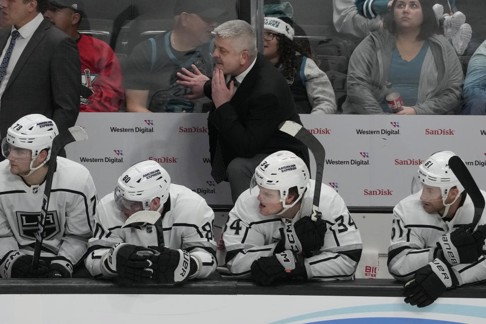 Los Angeles Kings coach Todd McLellan watches play during the third period of the team's NHL hockey game against the San Jose Sharks in San Jose, Calif., Tuesday, Dec. 19, 2023. (AP Photo/Jeff Chiu)