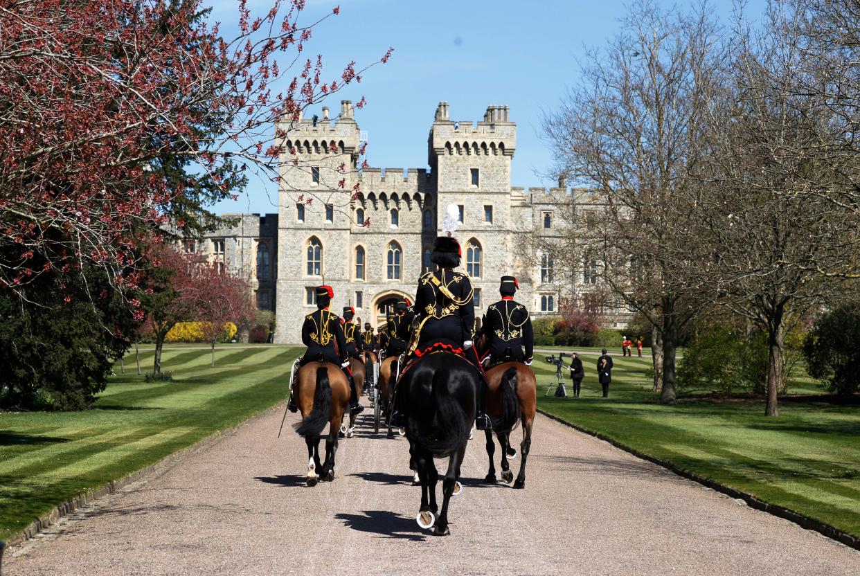 Officers of The King's Troop Royal Horse Artillery arrive for the Gun Salute for the funeral of Britain's Prince Philip at Windsor Castle in Windsor, England Saturday, April 17, 2021.