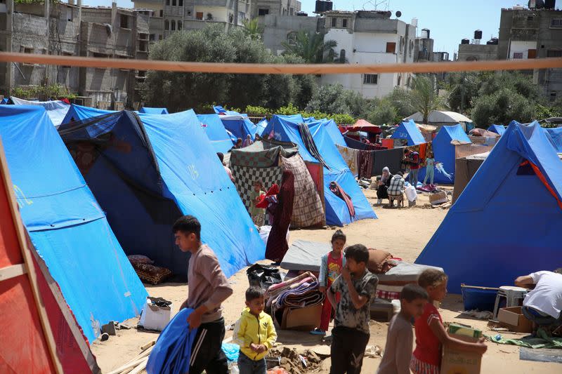 People flee the eastern parts of Rafah after the Israeli military began evacuating Palestinian civilians ahead of a threatened assault on the southern Gazan city