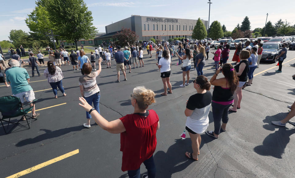 People from several area churches gather June 9 to pray together in the parking lot of Evangel Church in Hanover Park, Illinois, in what was planned as a nonpolitical spiritual event, rather than a protest, in memory of George Floyd. (Photo: Brian Hill/Daily Herald via Associated Press)