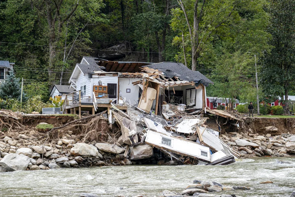 Damaged structures. (Allison Joyce / AFP via Getty Images)