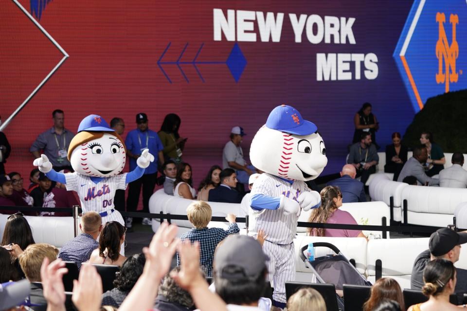 The New York Mets mascots perform during the MLB draft on Sunday.