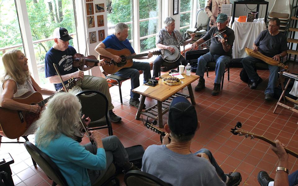 A large group of musicians jam in the Spring Mill Nature Center Wednesday, Aug. 23, 2023. Becky Sprinkle can be seen at left in the picture.