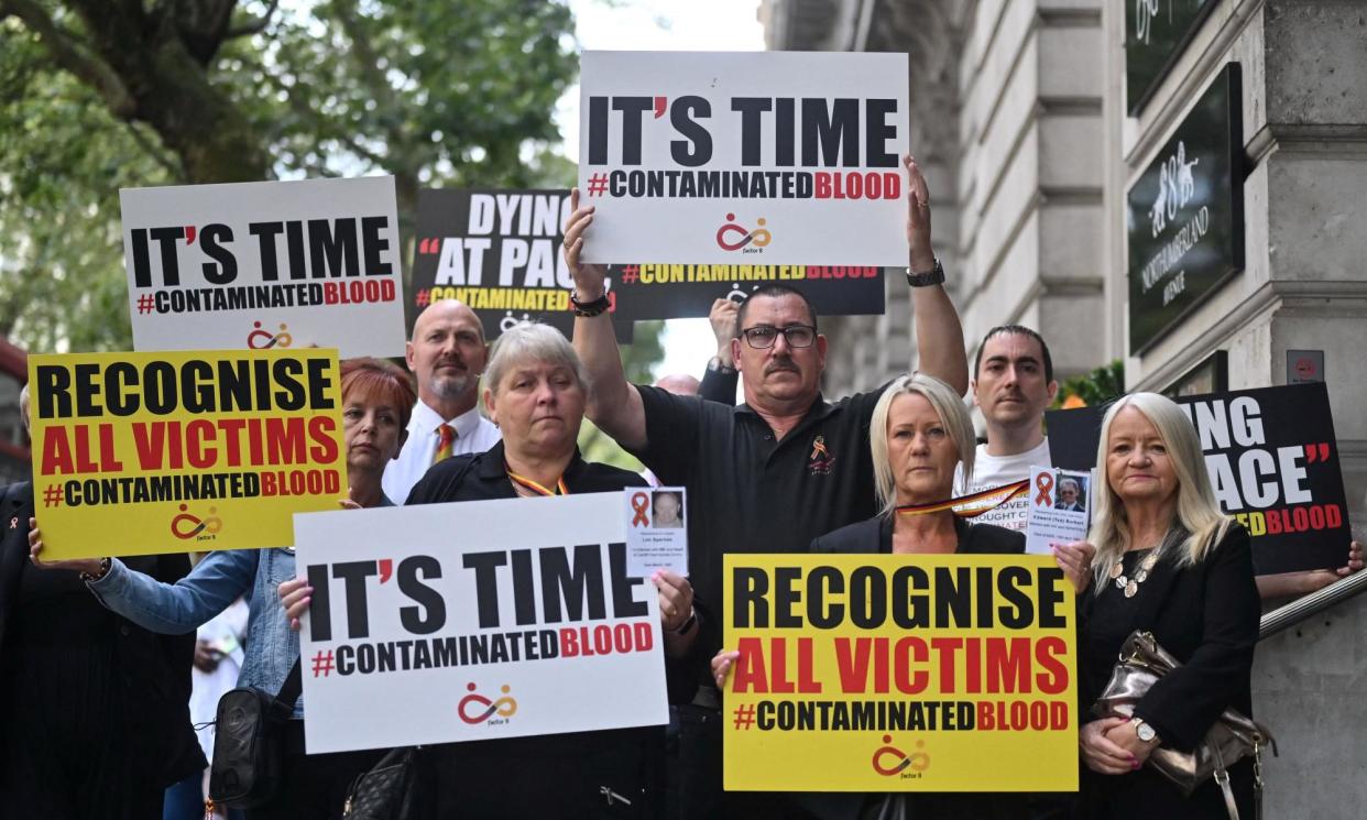 <span>Demonstrators protest outside the inquiry into the infected blood scandal in London in July 2023.</span><span>Photograph: Justin Tallis/AFP/Getty Images</span>