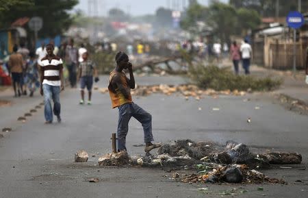 A man stands on a street after a protest against Burundi President Pierre Nkurunziza and his bid for a third term in Bujumbura, Burundi, May 25, 2015. REUTERS/Goran Tomasevic