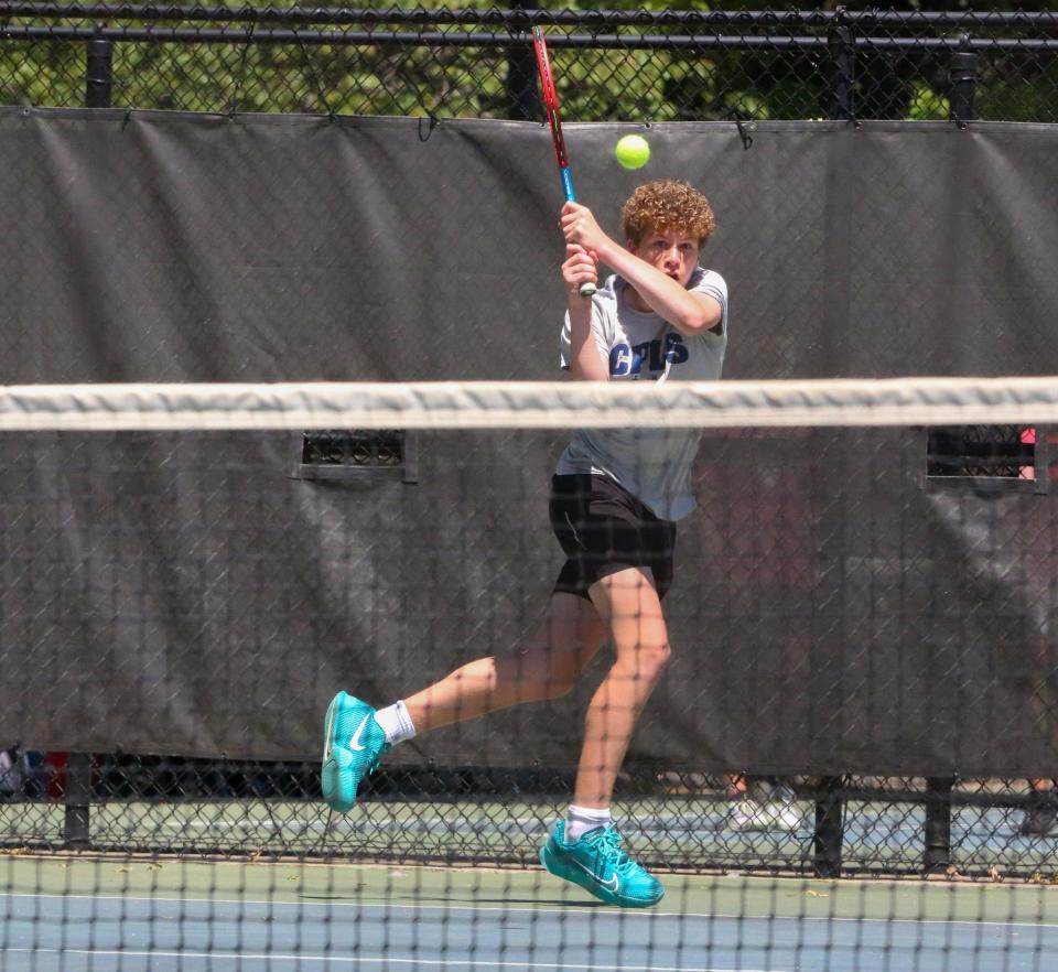 Cair Paravel's Drew Fay returns a shot during the Class 3-1A State Tennis Tournament third place match in Prairie Village on Saturday, May 11.