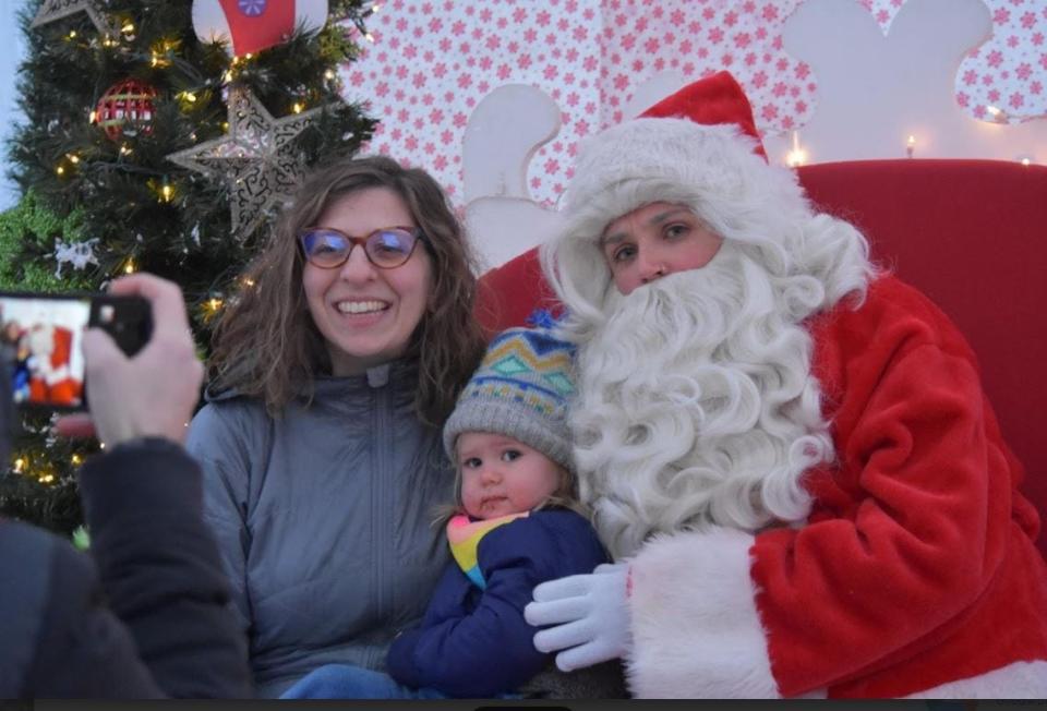 Picture with Santa at Corktown Aglow in Southwest Detroit.