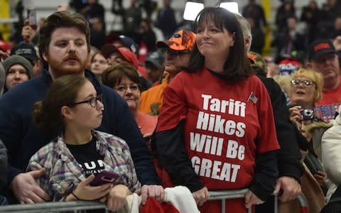 Donald Trump supporters attends the Make America Great Again Rally  - Credit: AFP