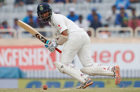 India v Australia - Third Test cricket match - Jharkhand State Cricket Association Stadium, Ranchi, India - 19/03/17 - India's Cheteshwar Pujara plays a shot. REUTERS/Adnan Abidi