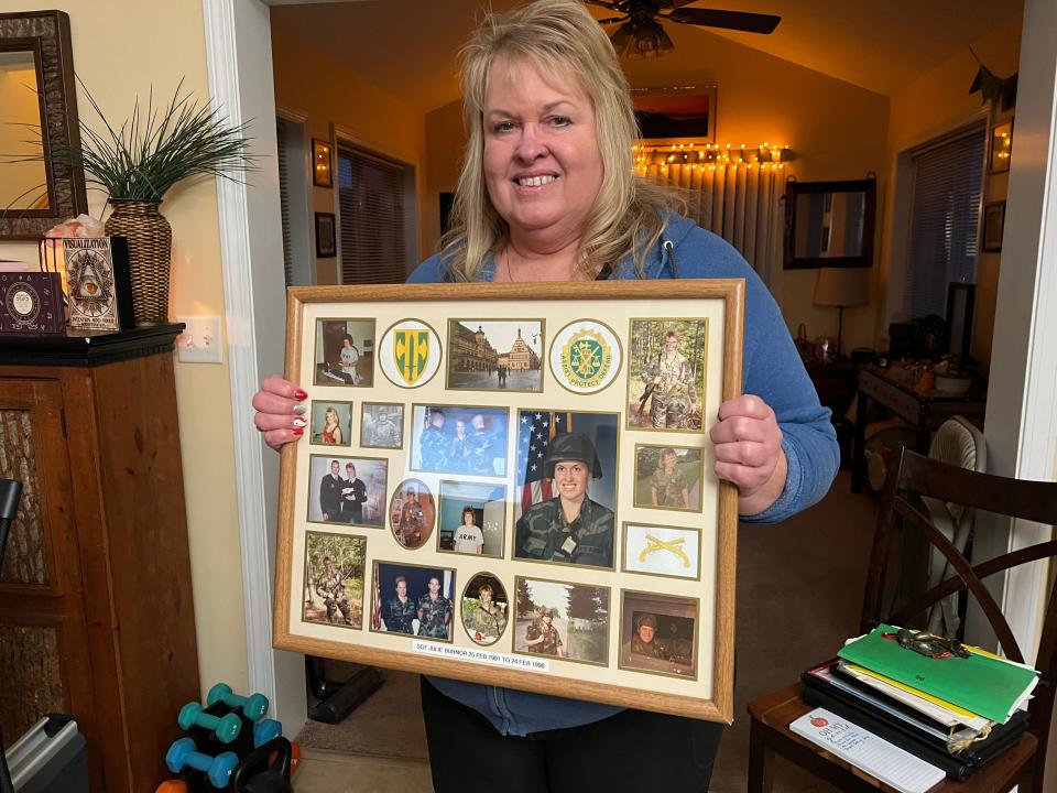 Julie Rinaldi shows off pictures of her military days in the Army and National Guard during her eleven years of service. The Fairfax veteran hadn't been paid the military education benefits promised her by Vermont State University and was seeking answers on Dec. 1, 2023.