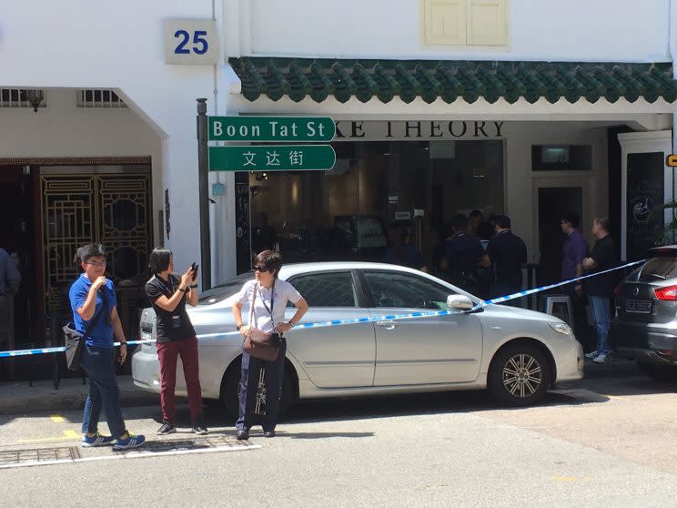 Police respond to an incident at Boon Tat street on Monday (10 July). Photo: Gabriel Choo/Yahoo Singapore