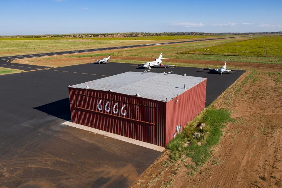 The property includes an airplane hangar and a private landing strip.