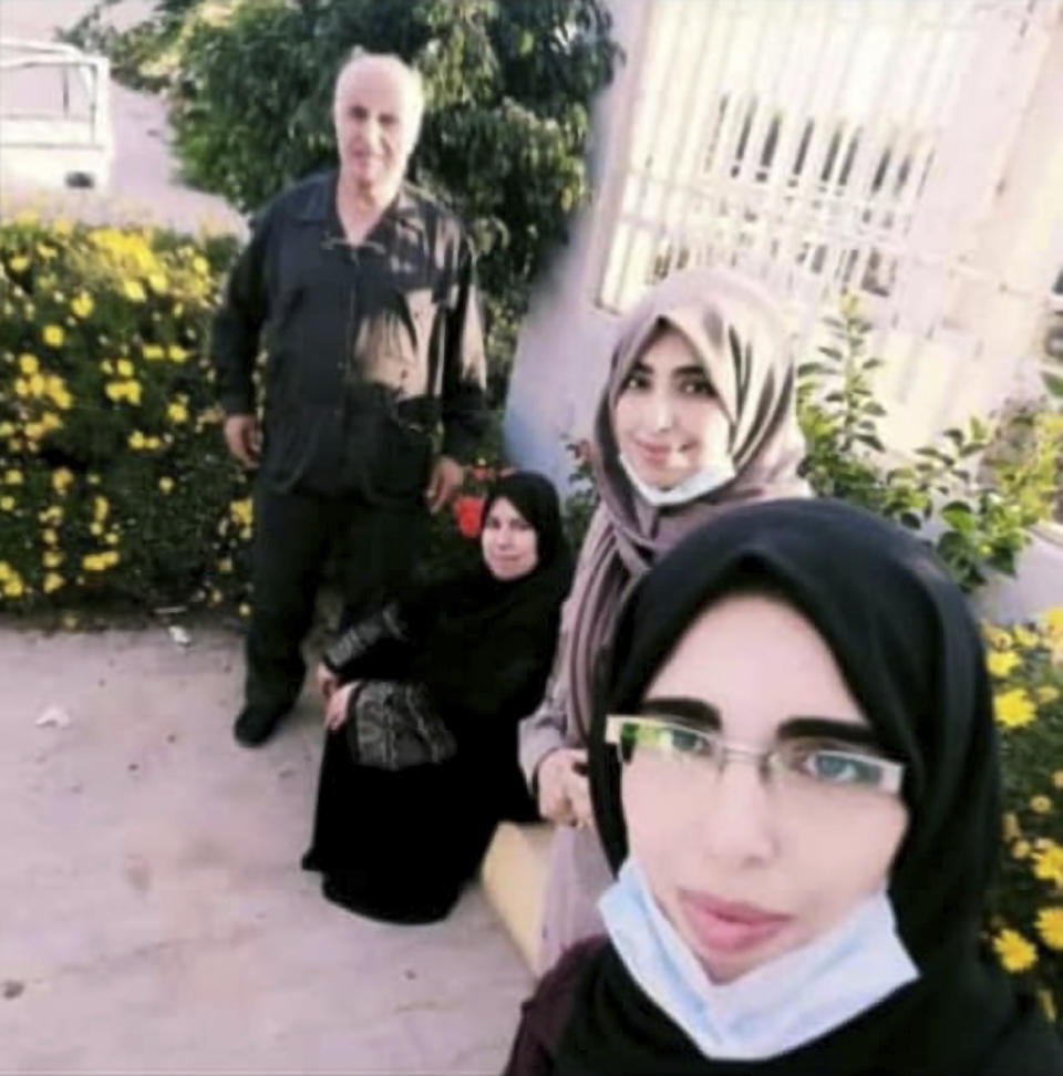 This photo provided by the family of Saleh Sariyeh, a Palestinian originally from the Ein el-Hilweh refugee camp in Lebanon who had lived in Derna for decades, shows him, from left, with his wife, Sanaa Jammal and two daughters, Walaa, 27, and Hoda, 25, as they take a selfie in the Libyan city of Derna in 2021. On Monday, the 62-year-old architect was killed along with his wife and two daughters in Libya’s coastal city of Derna, when their home was washed away by flooding that devastated the city. (Courtesy of family of Saleh Sariyeh via AP)
