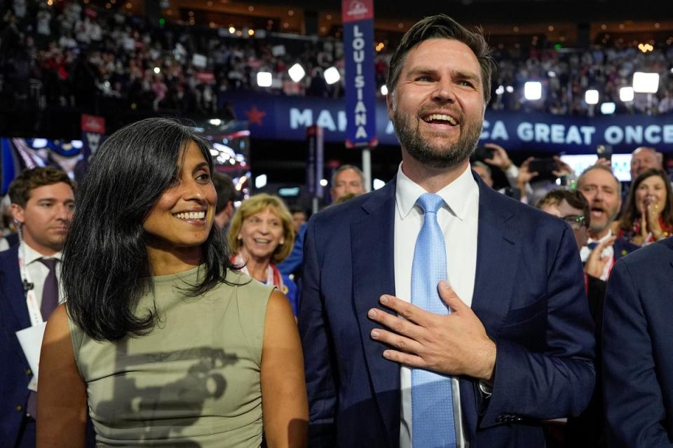 JD Vance and his wife Usha Chilukuri Vance arrive on the floor during the first day of the 2024 Republican National Convention on Monday, July 15, 2024, in Milwaukee. (AP)