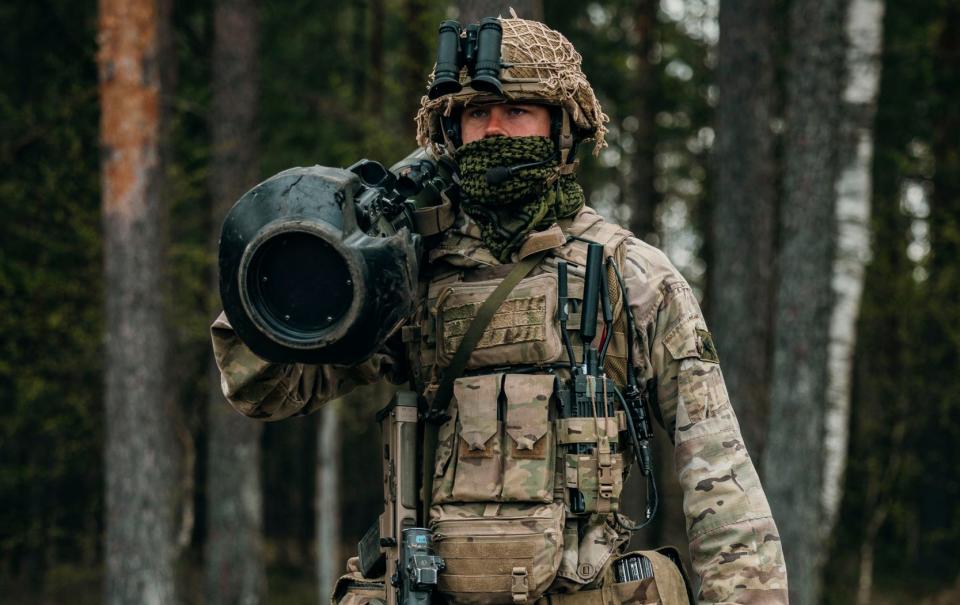 A paratrooper showcases the next generation light anti-tank weapon during Exercise Swift Response