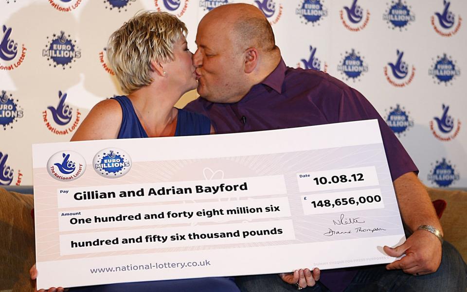 Adrian Bayford, 41, and wife Gillian, 40, from Haverhill, Suffolk after they won the EuroMillions jackpot in 2012 - PA