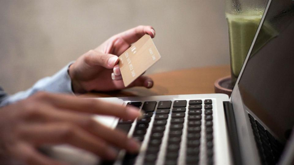 STOCK PHOTO: A consumer uses a credit card (STOCK PHOTO/Getty Images)