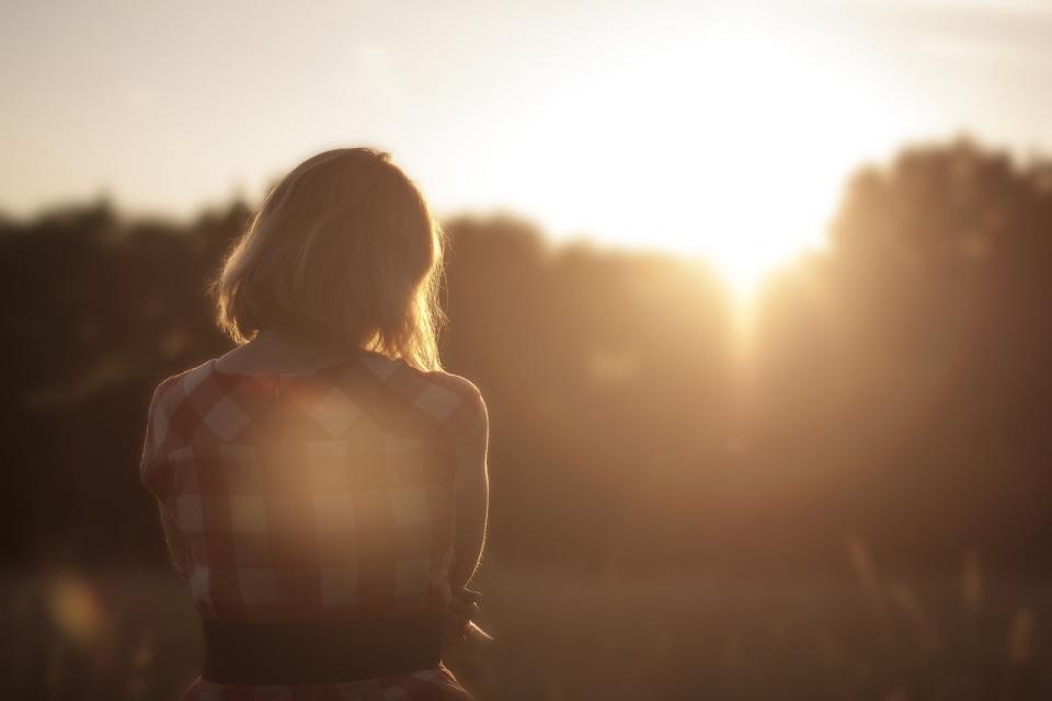 Woman against sunset