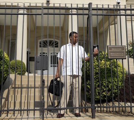 A man leaves the Cuban Interests Section in Washington, July 1, 2015. REUTERS/Gary Cameron