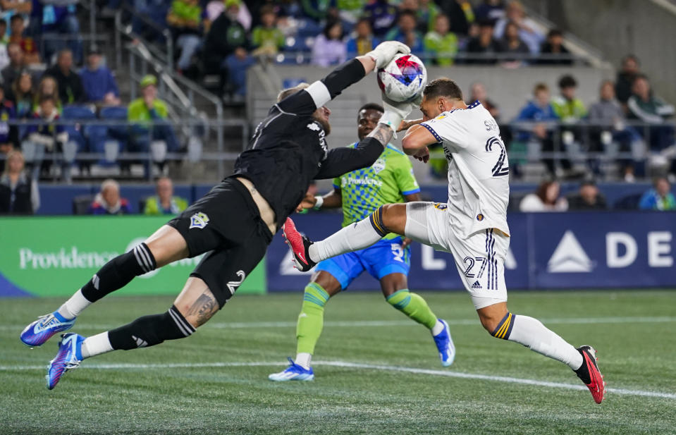 Seattle Sounders goalkeeper Stefan Frei (24) makes a save against LA Galaxy forward Billy Sharp (27) during the first half of an MLS soccer match Wednesday, Oct. 4, 2023, in Seattle. (AP Photo/Lindsey Wasson)