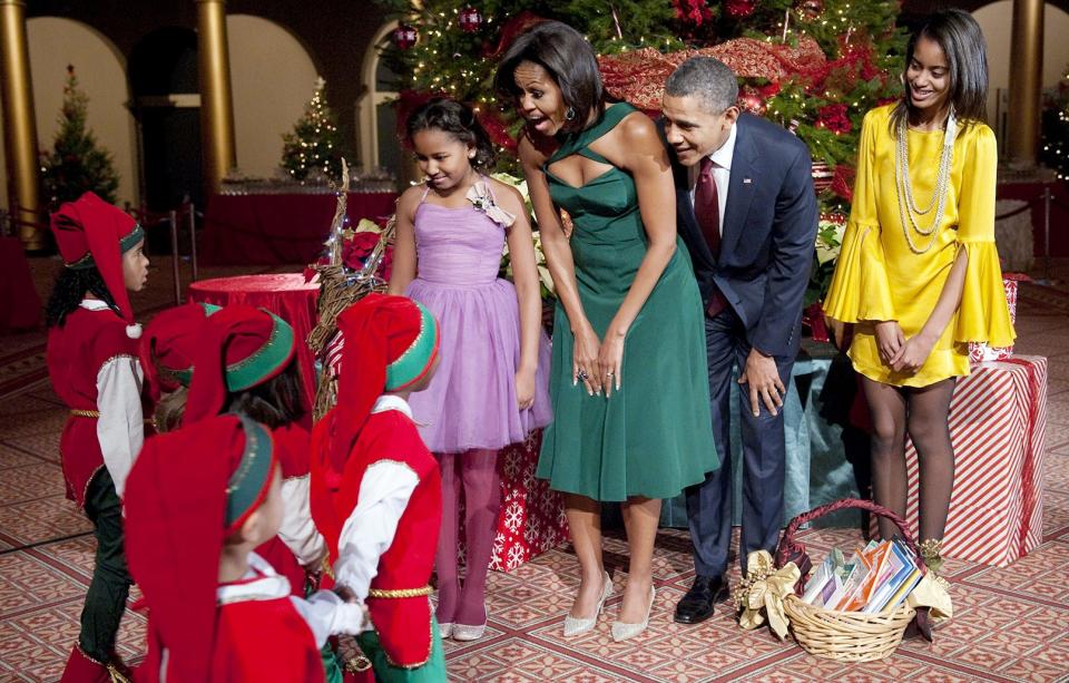 <strong>Sasha,</strong> Michelle, <strong>Barack,</strong> and <strong>Malia Obama</strong> meet some Christmas elves before the taping of the <em>Christmas in Washington</em> special, December 2011.