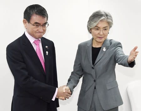 South Korean Foreign Minister Kang Kyung-wha meets her Japanese counterpart Taro Kono during the ASEAN Foreign Ministers' Meeting in Bangkok