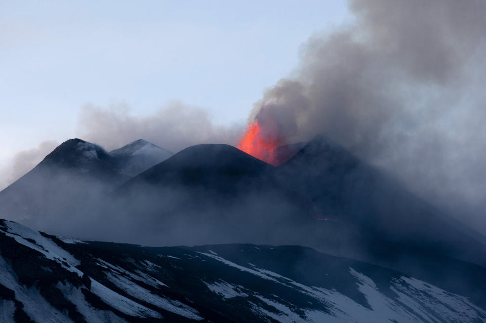 Italy's volcanic Mount Etna spews lava during an eruption on the southern Italian island of Sicily April 11, 2013. Mount Etna is Europe's tallest and most active volcano. Picture taken April 11, 2013. REUTERS/Antonio Parrinello (ITALY - Tags: ENVIRONMENT SOCIETY)