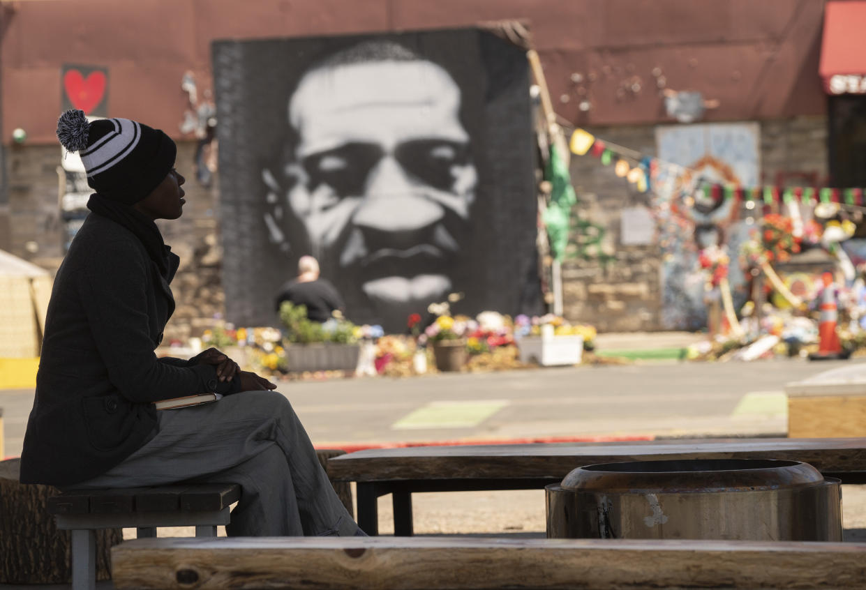 A woman sits in a former gas station that has been converted into a gathering space at George Floyd Square. (Judy Griesedieck for Yahoo News)