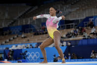 Rebeca Andrade, of Brazil, performs on the floor during the artistic gymnastics women's apparatus final at the 2020 Summer Olympics, Monday, Aug. 2, 2021, in Tokyo, Japan. (AP Photo/Ashley Landis)