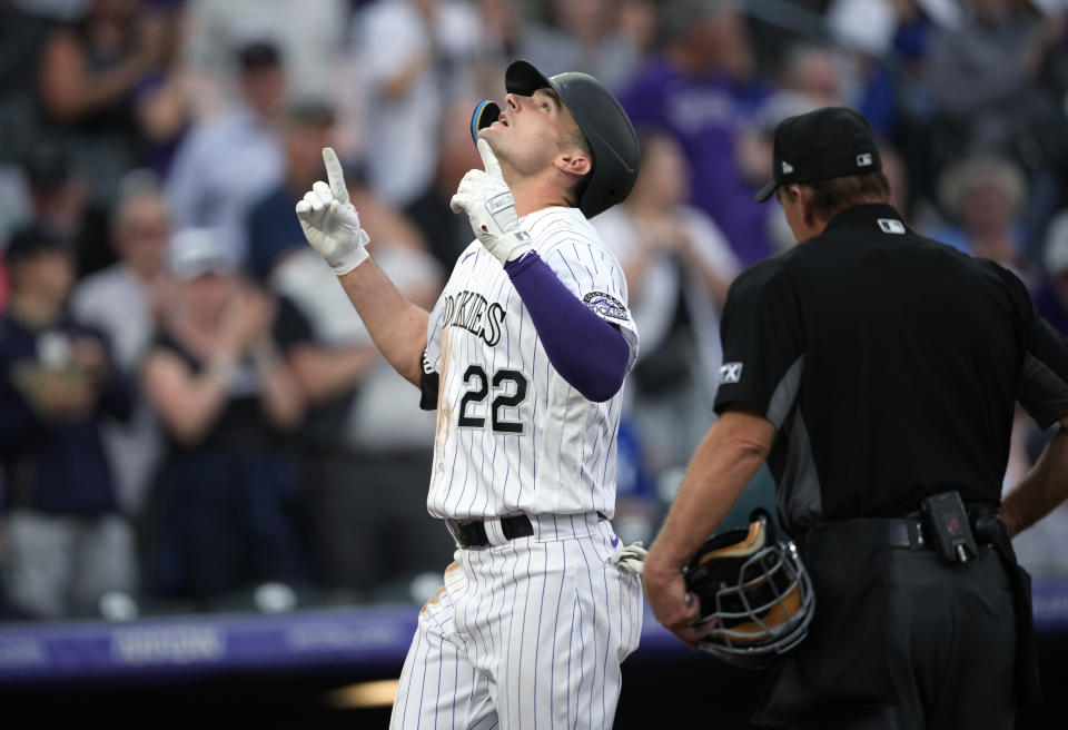 Colorado Rockies' Sam Hilliard gestures as he crosses home plate after hitting a three-run home run off Kansas City Royals starting pitcher Carlos Hernandez during the third inning of a baseball game Saturday, May 14, 2022, in Denver. (AP Photo/David Zalubowski)