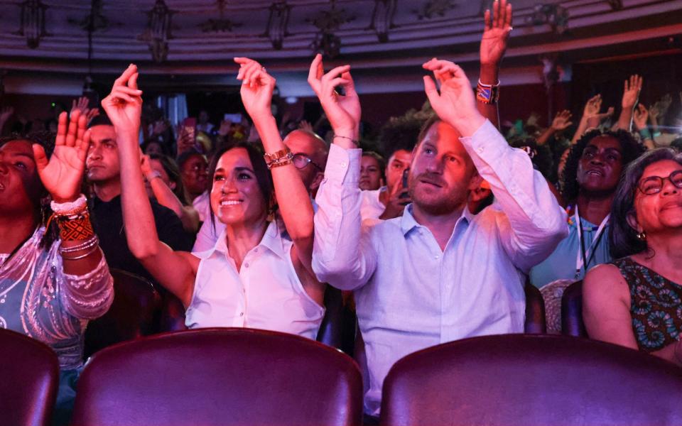 Meghan, Duchess of Sussex and Prince Harry, Duke of Sussex attend the Afro-Descendant Women and Power: Voice of Equity at the Teatro Municipal