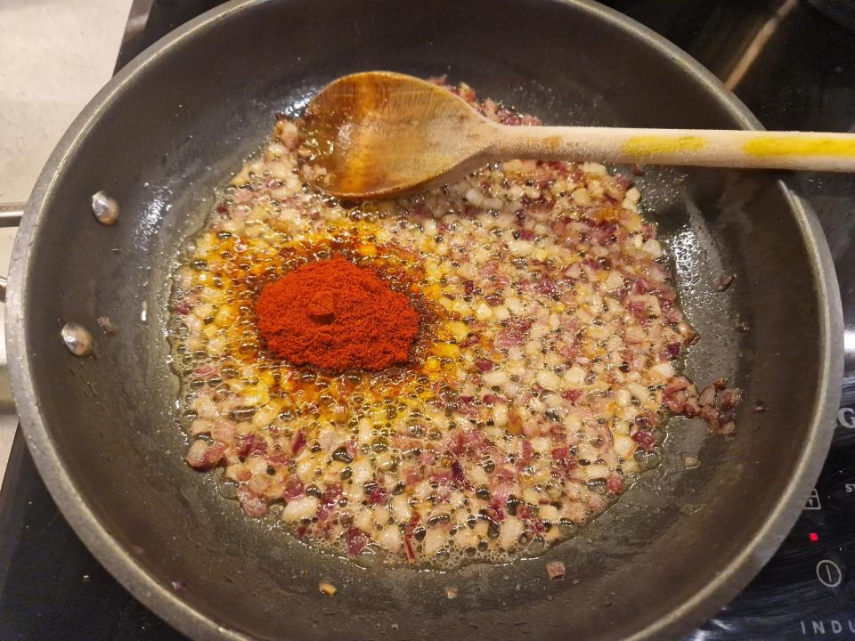 onions, oil, and spices in a frying pan