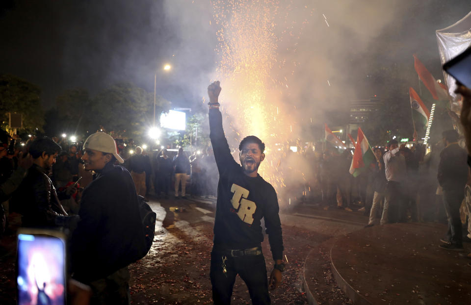 An Indian man shouts slogans during a gathering to celebrate reports of Indian aircrafts bombing Pakistan territory, in New Delhi, India, Tuesday, Feb. 26, 2019. A pre-dawn airstrike inside Pakistan that India said targeted a terrorist training camp and killed a "very large number" of militants ratcheted up tensions on Tuesday between the two nuclear-armed rivals at odds over the disputed territory of Kashmir. (AP Photo/Altaf Qadri)