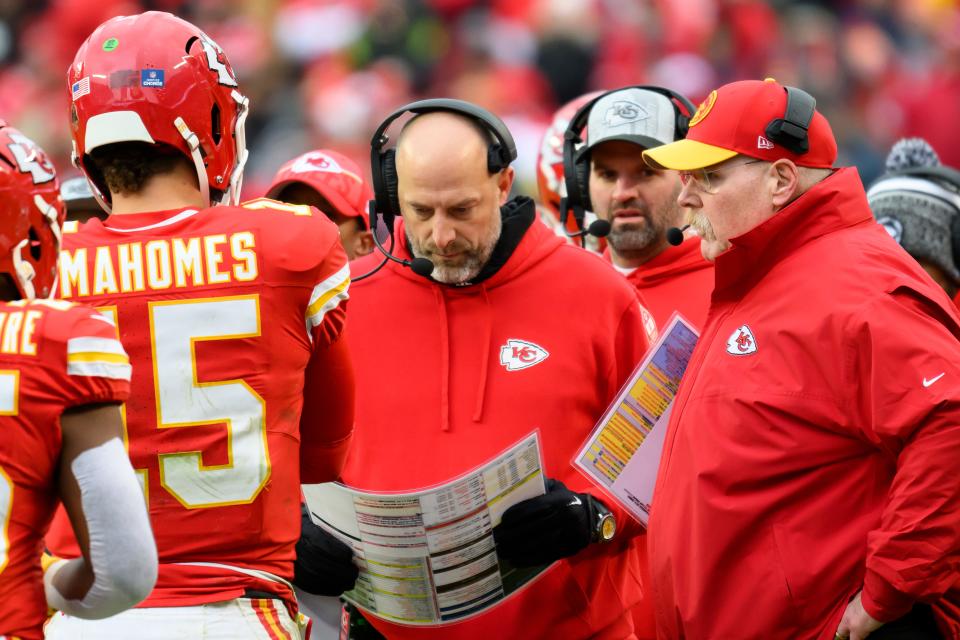 Kansas City Chiefs head coach Andy Reid, right, offensive coordinator Matt Nagy, center, and Chiefs quarterback Patrick Mahomes (15) meet during a break in play during a game against the Las Vegas Raiders, Monday, Dec. 25, 2023 in Kansas City, Mo.