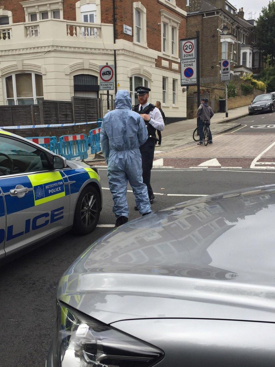 Police near the scene in Tufnell Park, north London following the fatal stabbing of a 29-year-old man (PA)