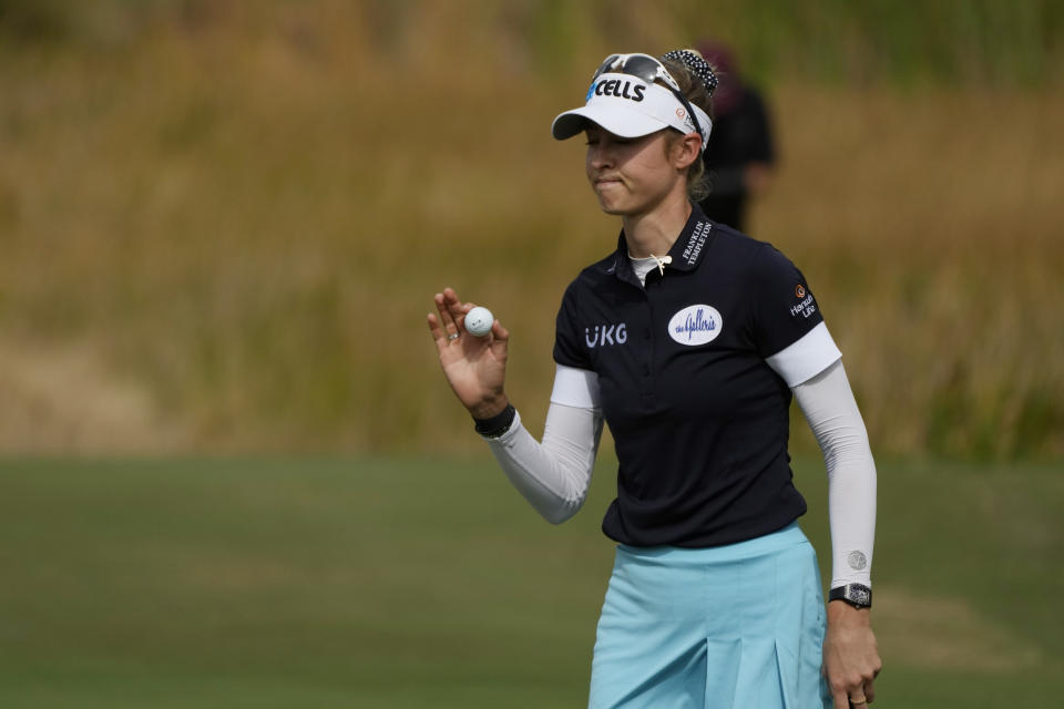 Nelly Korda tips her ball to the gallery on the eighth green during the final round of the LPGA Tour Championship golf tournament, Sunday, Nov. 21, 2021, in Naples, Fla. (AP Photo/Rebecca Blackwell)