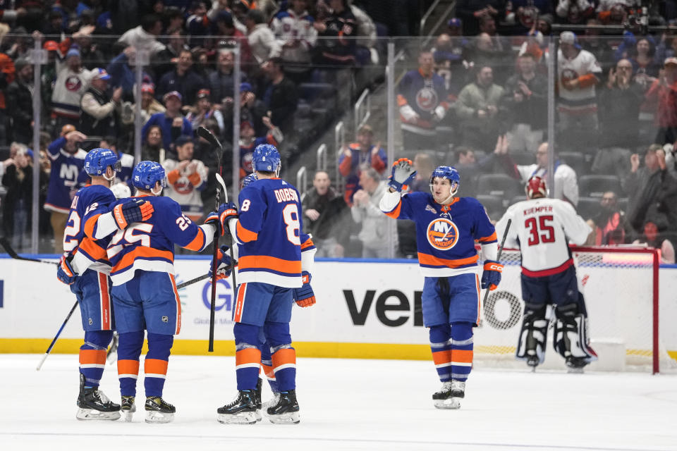 Washington Capitals goaltender Darcy Kuemper (35) reacts as the New York Islanders celebrate a goal by Sebastian Aho (25) during the first period of an NHL hockey game Monday, Jan. 16, 2023, in Elmont, N.Y. (AP Photo/Frank Franklin II)