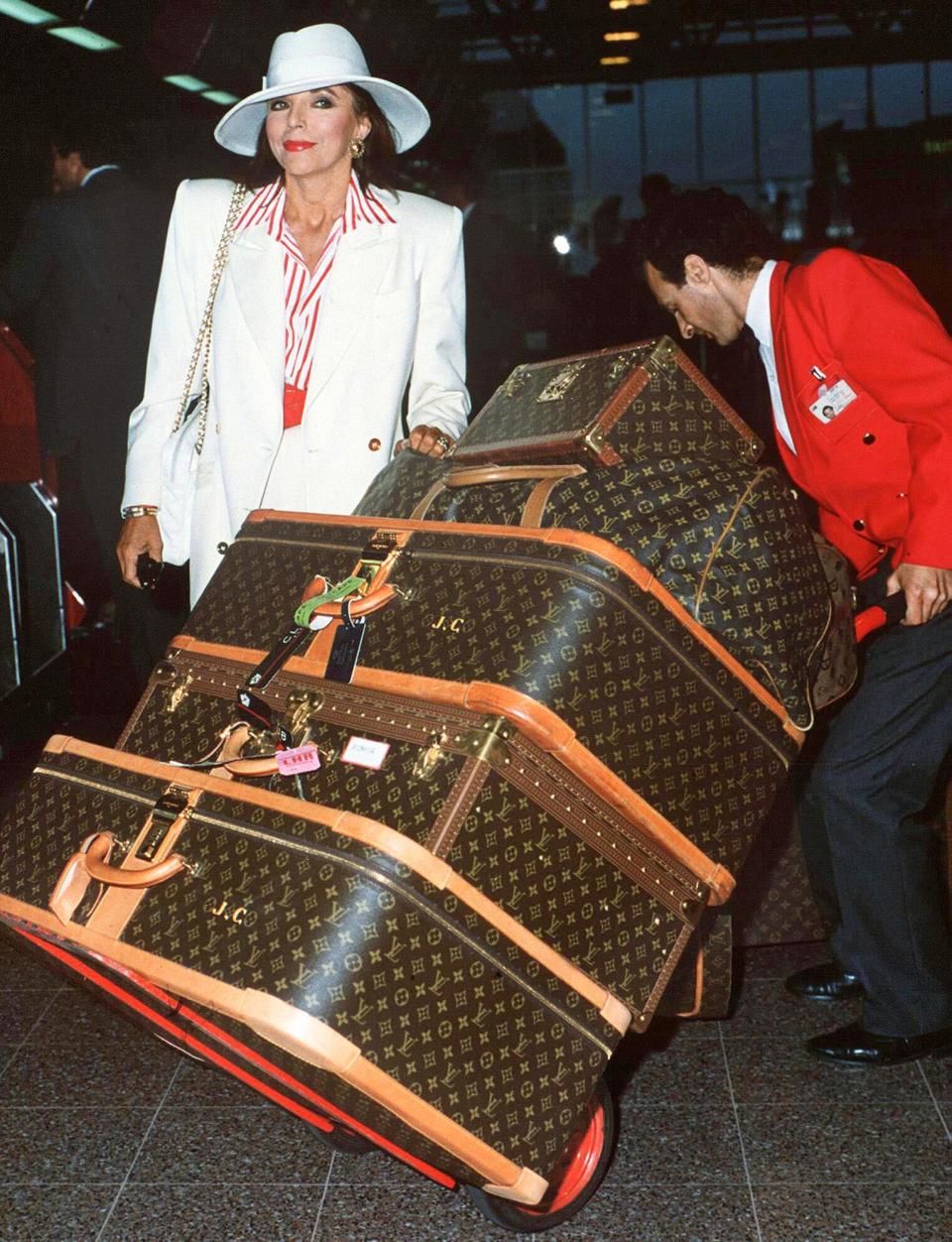 <p>Famous for her love of luxury as Alexis Carrington Colby on the nighttime soap <em>Dynasty</em>, the star took logos to a new level at London's Heathrow. "Carrying luggage can be a back-breaking job with me," she tweeted in 2018.</p>