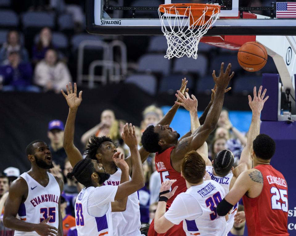 Southern Methodist University’s Isiaha Mike (15) and Evansville's Artur Labinowicz (2) collide as they fight for a rebound during the second half at Ford Center in Evansville, Ind., Monday, Nov. 18, 2019. The UE Purple Aces fell 59-57 to the SMU Mustangs.