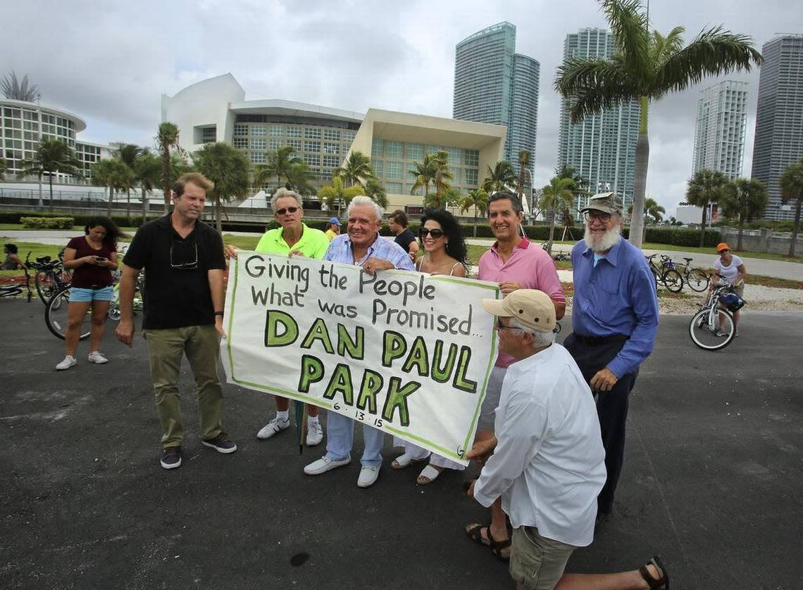 In 2015, Peter Ehrlich, from left, Ken Sternweis, Jack Batel, Maria Diaz, Daniel Somarriba, Seta Sklarey and Glenn Terry hold a sign advocating that the parcel of land behind Miami’s basketball arena be renamed “Dan Paul Park.”