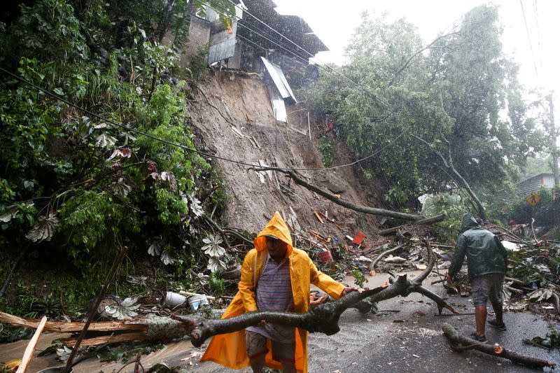 Tropical Storm Julia hits with wind and rain, in San Salvador