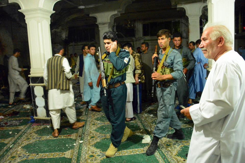 <p>Afghan security personel inspect the site of a suicide bomb attack at a Shiite mosque in Herat on August 1, 2017. (Photo: Hoshang Hashimi/AFP/Getty Images) </p>