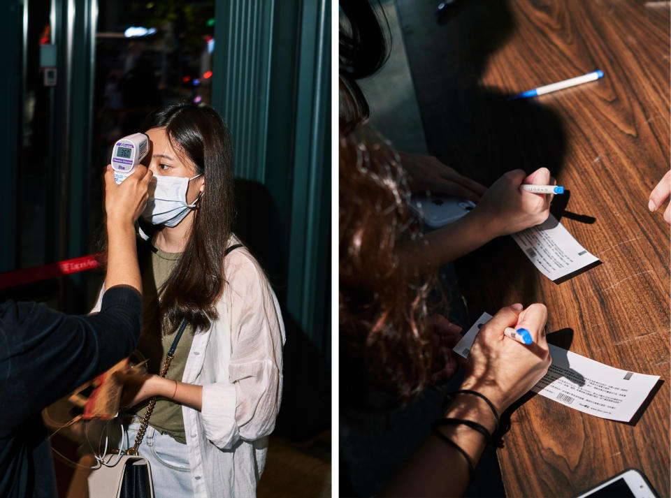 Left: An attendee receives a temperature check. Based on guidelines from the Taipei City Government Department of Health, no individual with a forehead temperature above 37.5°C (99.5°F) and ear temperature above 38°C (100.4°F) could enter the venue. Right: Attendees write personal information on their ticket stubs to submit to venue staff before entering the Taipei Arena<span class="copyright">An Rong Xu for TIME</span>