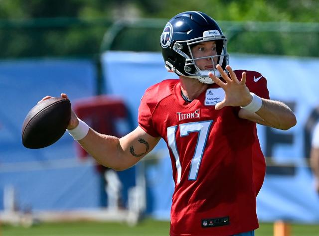 Ryan Tannehill of the Tennessee Titans runs the ball and is chased