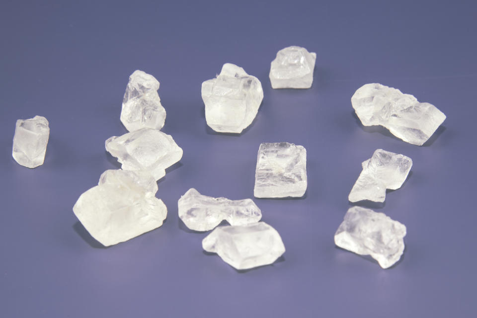 Crystal rocks form a loose circular pattern on a table