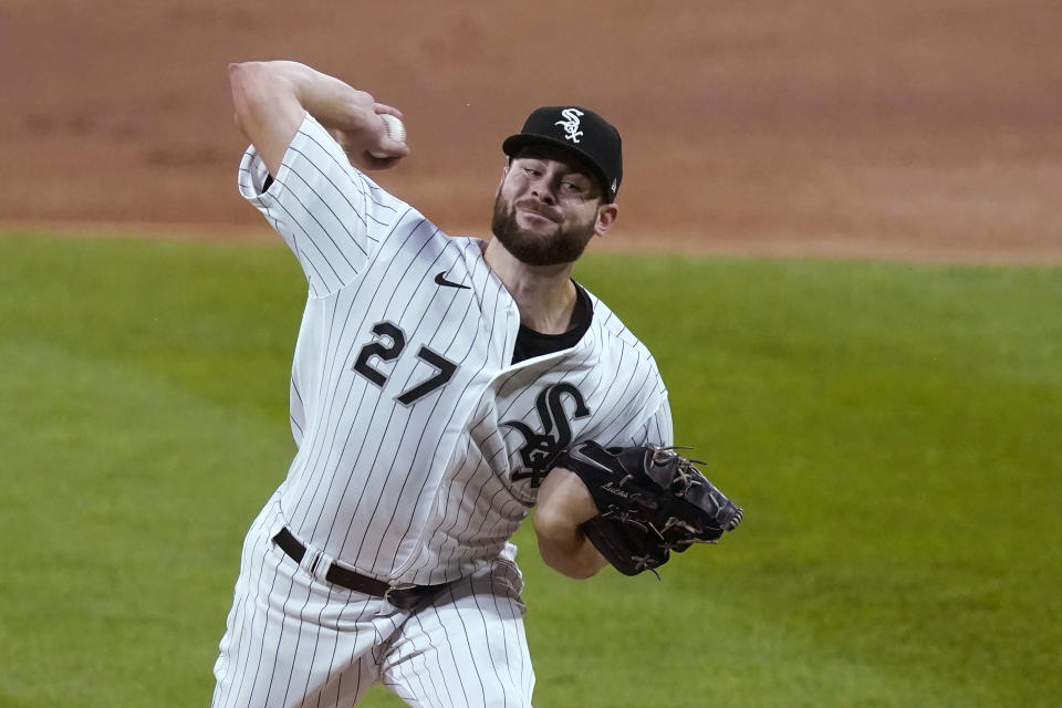 FILE - In this Friday, Sept. 11, 2020 file photo, Chicago White Sox starting pitcher Lucas Giolito delivers during the first inning of the team's baseball game against the Detroit Tigers in Chicago. Lucas Giolito, Max Fried and Jack Flaherty were teammates nine years ago at Harvard-Westlake, a prestigious prep school in Los Angeles. On Thursday, April 1, 2021, all three will be opening day starting pitchers in the major leagues. (AP Photo/Charles Rex Arbogast, File)