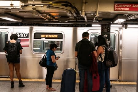 A train is seen out of service at Penn Station, as a blackout affects buildings and traffic during widespread power outages in the Manhattan borough of New York