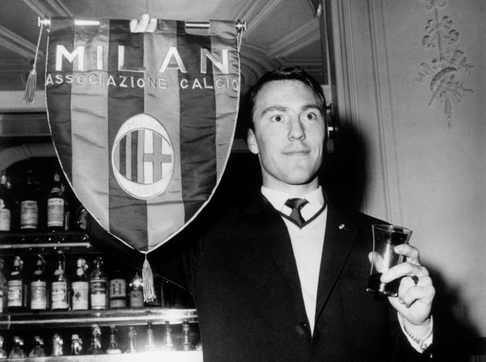 Jimmy Greaves holds a Milan pennant during a visit to the club in 1961 before his transfer.