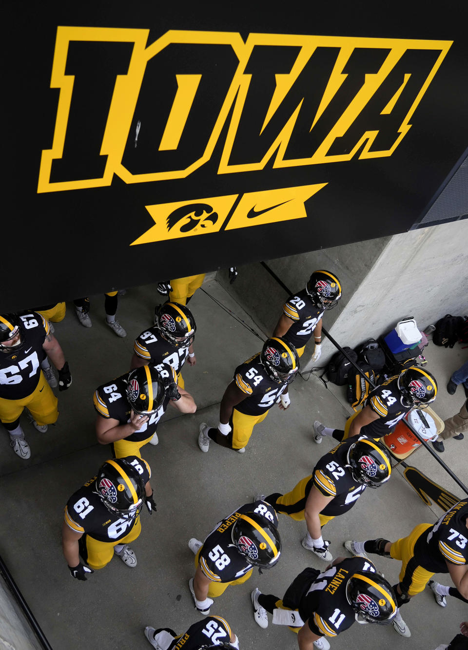 Members of the Iowa football team take the field prior to kickoff against Rutgers in an NCAA college football game, Saturday, Nov. 11, 2023, in Iowa City, Iowa. (AP Photo/Bryon Houlgrave)